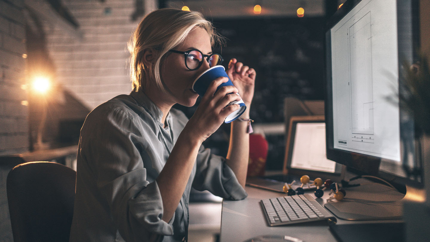 woman drinking coffee while working banner