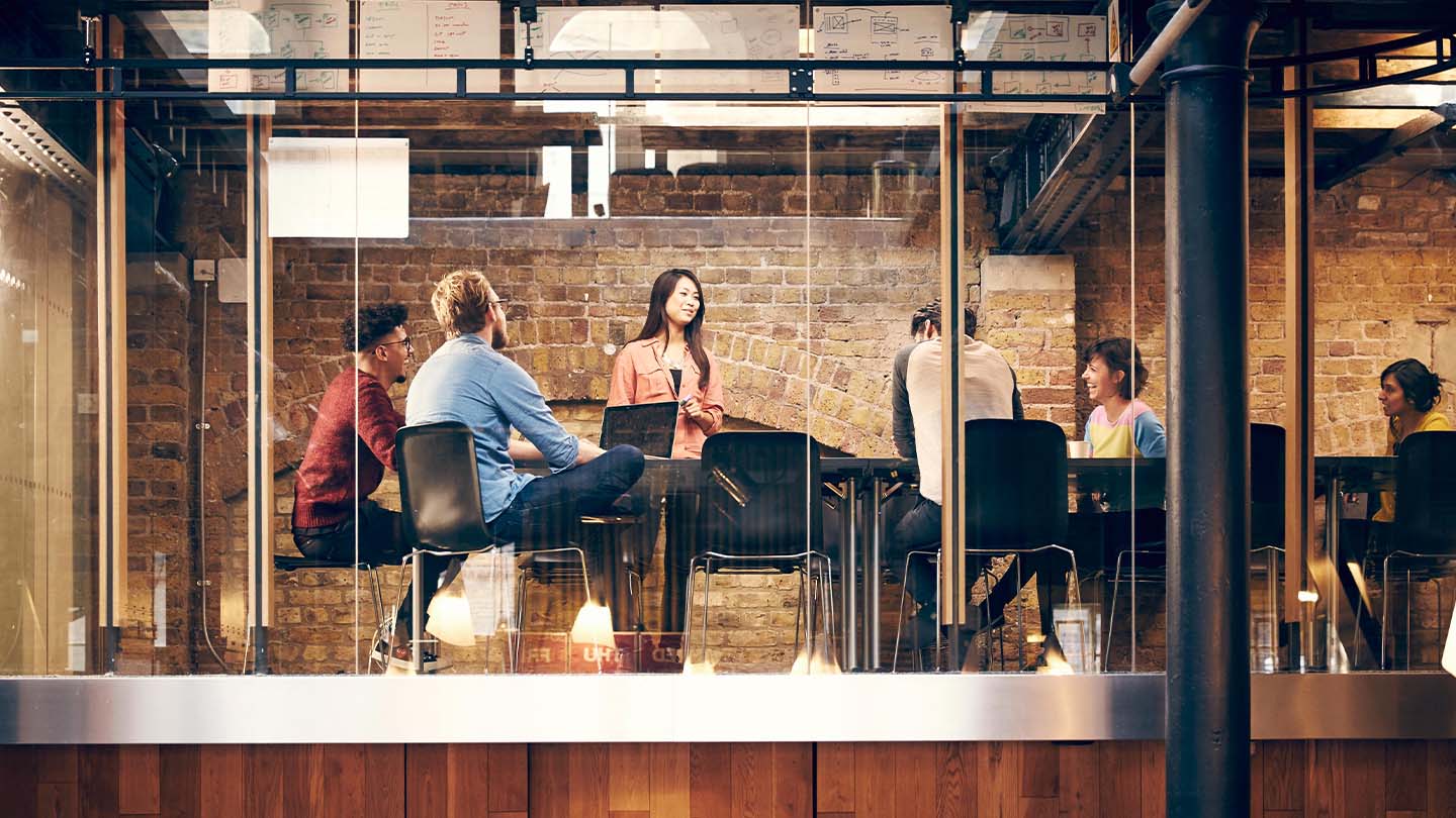 group of people in a meeting room banner