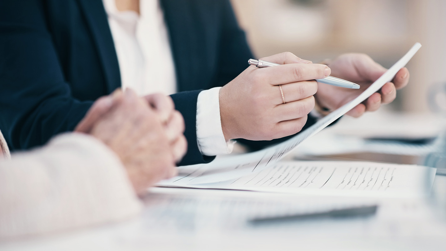Hands examining document